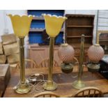 A pair of tall brass table lamps, height 65cm together with a brass two branch oil lamp with peach