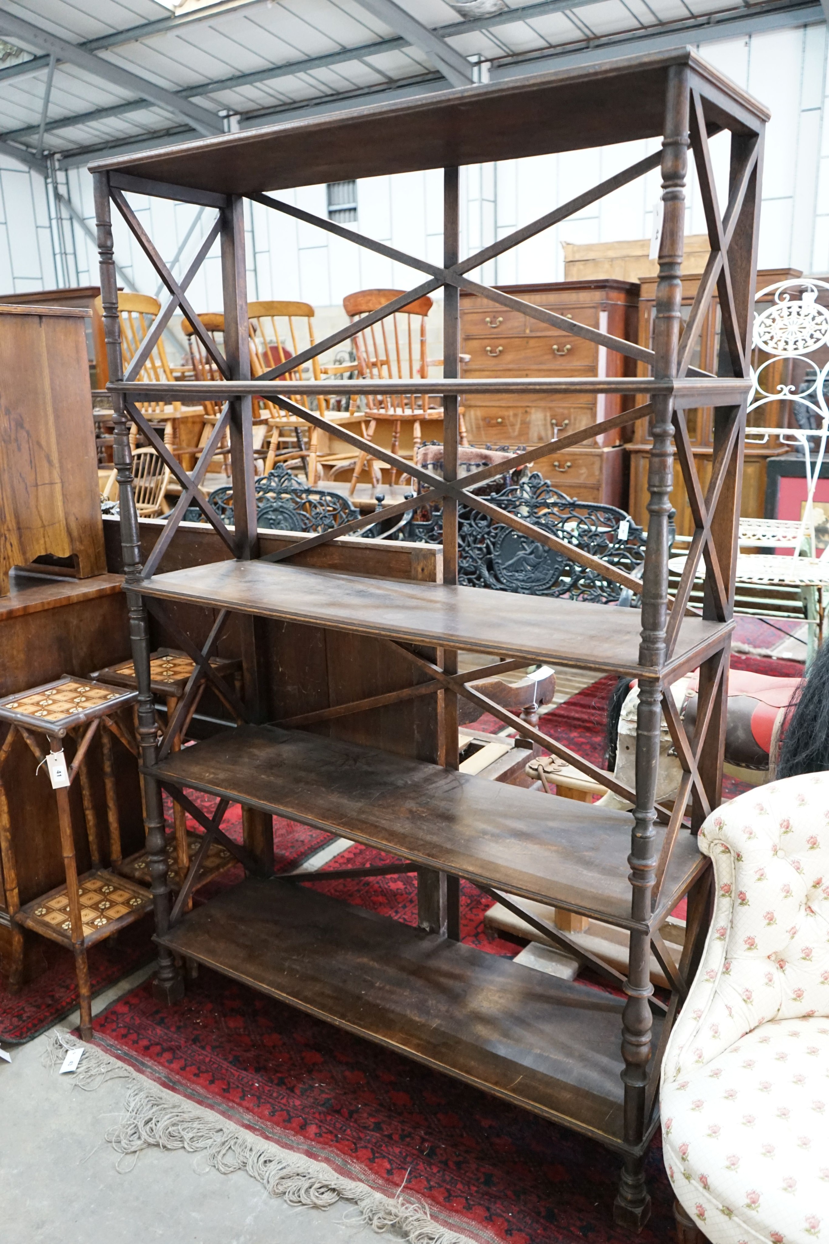 A Regency style four tier open bookcase, width 120cm, depth 38cm, height 184cm