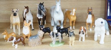 A large quantity of mixed Doulton, Beswick, dogs and horses,largest, Beswick shire horse 23cms