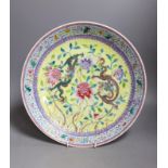 A Chinese yellow ground ‘dragon’ dish, Qianlong mark but Republic period34 cms diameter.