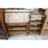 An Edwardian Art Nouveau oak student's desk, width 76cm, height 100cm together with a smaller open