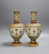 A pair of late 19th century Mettlach vases,26 cms high.