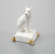 A rare English porcelain model of a cat seated on a cushion base, possibly Derby, c.1820-30, 4cm