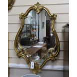 A gilt cartouche shaped mirror, width 51cm, height 80cm