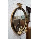 A pair of reproduction oval parcelgilt electric girandole wall mirrors, height 74cm