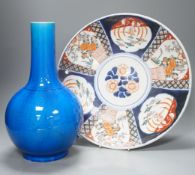 A large Japanese turquoise glazed bottle vase and an Imari dish,dish 37 cms diameter.