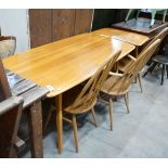 An Ercol rectangular light elm dining table with extension section, length 150cm, depth 76cm, height
