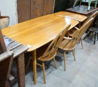 An Ercol rectangular light elm dining table with extension section, length 150cm, depth 76cm, height