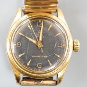 A gentleman's 1950's? mid-size steel and gold plated Tudor Oyster manual wind wrist watch, with