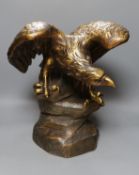 After G V Vaerenbergh, an Austrian large gilded and cold painted ceramic perched eagle - 46cm tall