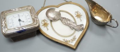 A 19th century gilt heart-shaped frame, A Japanese sterling figural spoon, a 1930's silver cream jug