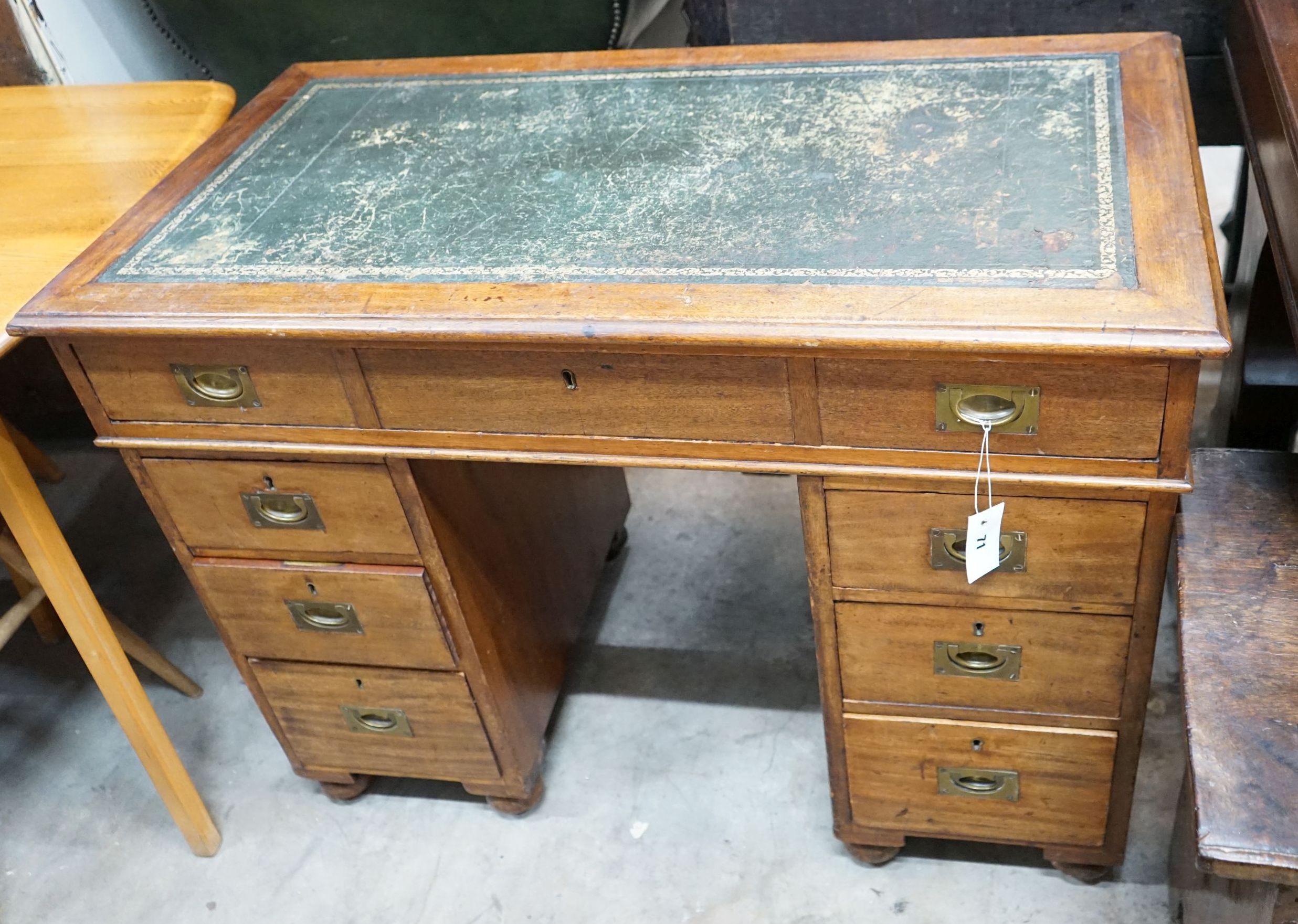 A Victorian mahogany military style pedestal desk with brass recessed handles, width 102cm, depth