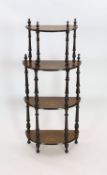 A late Victorian inlaid walnut D shaped four tier whatnot, width 59cm depth 28cm height 129cm