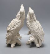 A pair of white resin cockatiels - 28cm tall