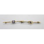 Two Edwardian 15ct bar brooches, one set with a sapphire, the other with sapphire and seed pearls
