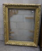 A Victorian rectangular giltwood and gesso picture frame, aperture 75 x 96 cms.