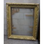 A Victorian rectangular giltwood and gesso picture frame, aperture 75 x 96 cms.