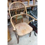 A late 19th / early 20th century elm and beech Windsor comb back elbow chair, width 64cm, depth