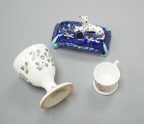 A mid 19th century Staffordshire porcelain Dalmatian pen holder and a cornflower spray egg cup and a