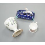 A mid 19th century Staffordshire porcelain Dalmatian pen holder and a cornflower spray egg cup and a