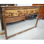 A 19th century and later gilt framed overmantel mirror with oil on canvas frieze decorated with