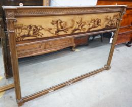 A 19th century and later gilt framed overmantel mirror with oil on canvas frieze decorated with