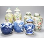 A pair of Chinese porcelain vases and covers, a pair of jars and covers, a metal mounted vase and