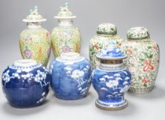 A pair of Chinese porcelain vases and covers, a pair of jars and covers, a metal mounted vase and