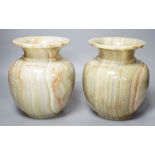 A pair of green onyx vases,23 cms high.