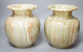 A pair of green onyx vases,23 cms high.
