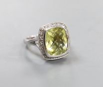 A modern 18k white metal, fancy cut quartz and diamond chip cluster set dress ring, size N, gross