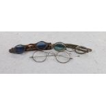 A pair of George IV silver mounted spectacles, with four lenses, (two folding and one missing),