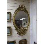 A Victorian giltwood and gesso girandole, width 56cm, height 96cm