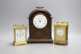 Two French brass carriage timepieces and an oak mantel clock,tallest carriage clock 12 cms high.