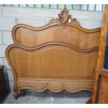 An early 20th century French carved oak double bedframe, width 136cm, headboard height 160cm