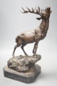 After Mene, a bronze stag on marble base, 38cm