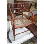 A Regency painted simulated bamboo cane seat elbow chair, width 54cm, depth 43cm, height 79cm