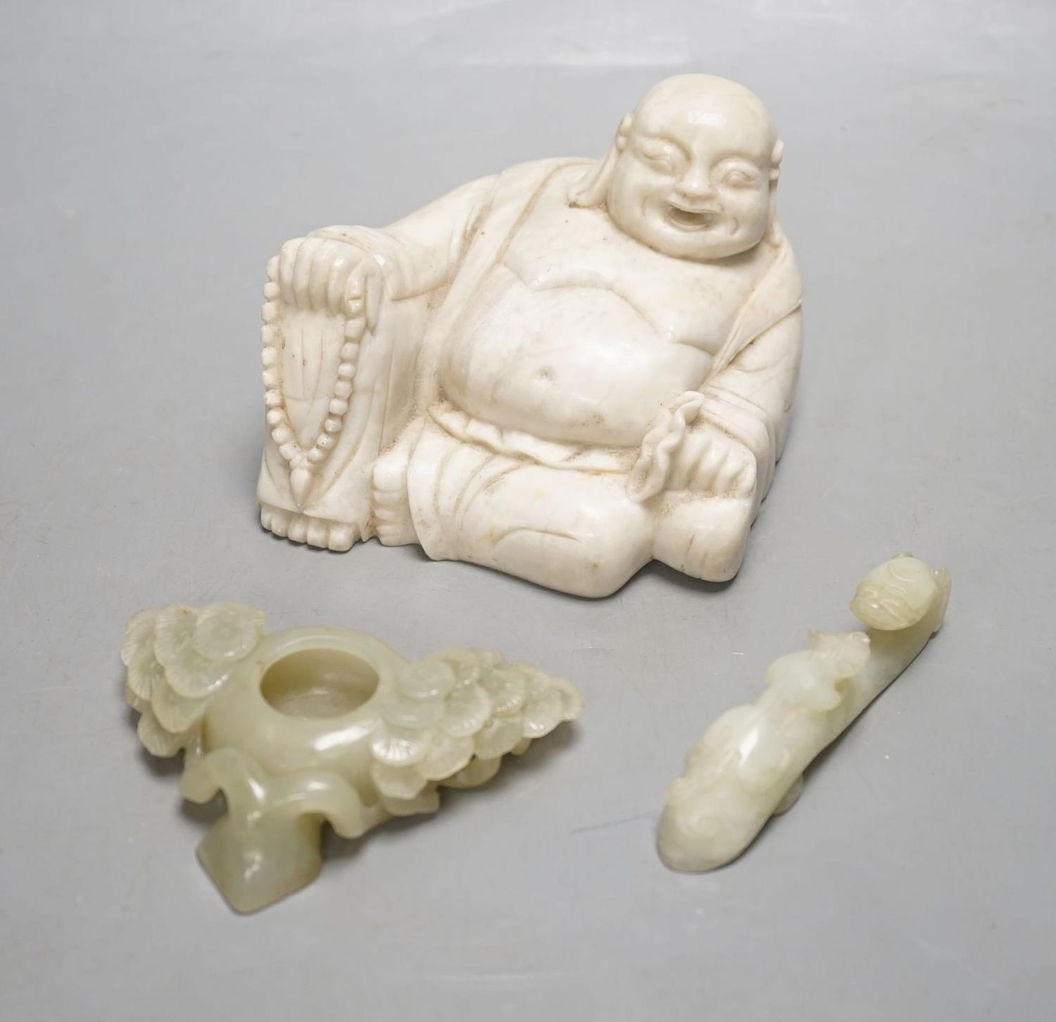 A Chinese celadon jade brushwasher, a bowenite jade belt hook and a soapstone figure of Budai,buddha