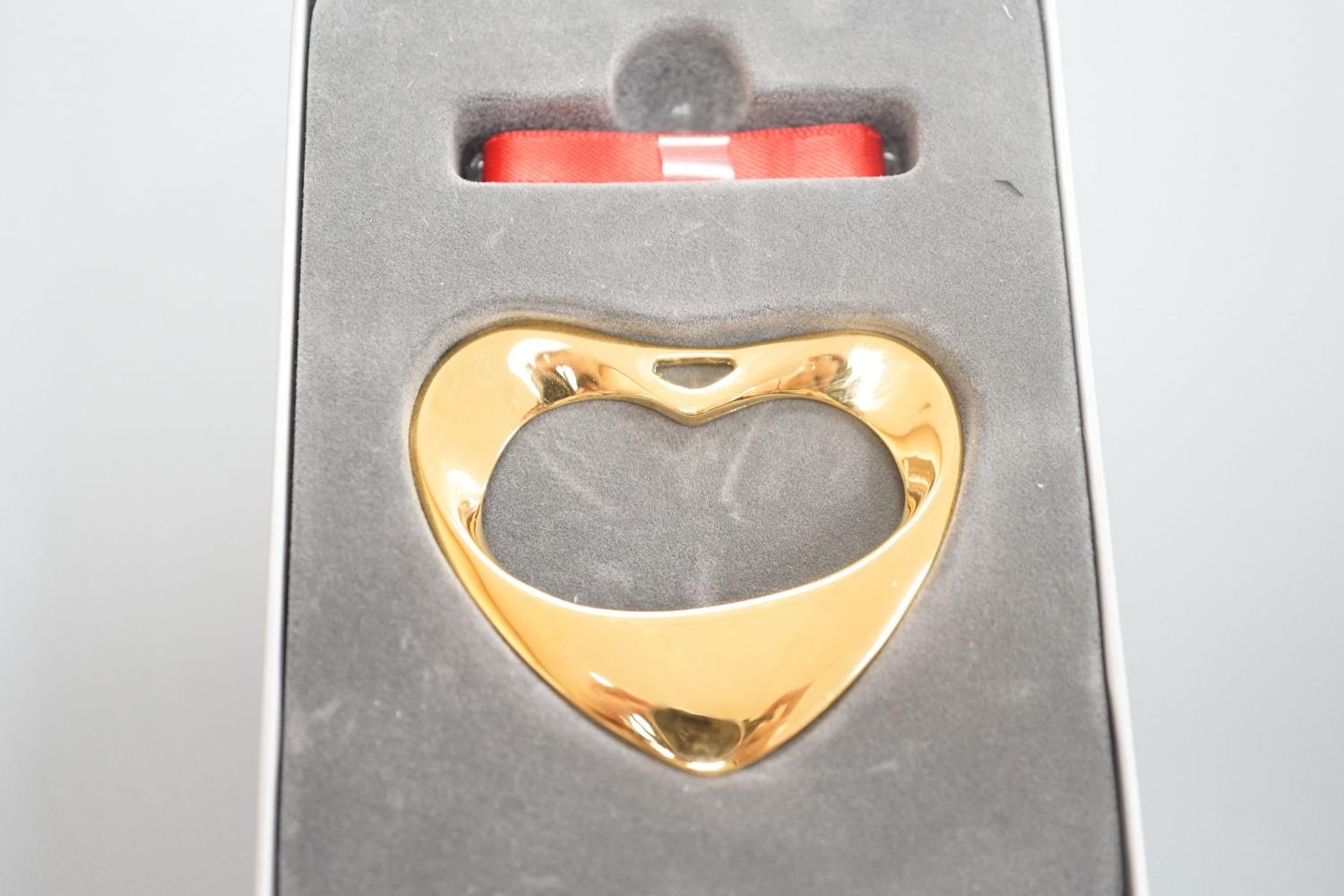 A modern Georg Jensen gold plated open work heart shaped pendant, no. 152A, width 55mm, with red and - Image 2 of 2