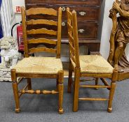 A good set of twelve reproduction Belvedere Furniture light oak ladderback dining chairs with drop
