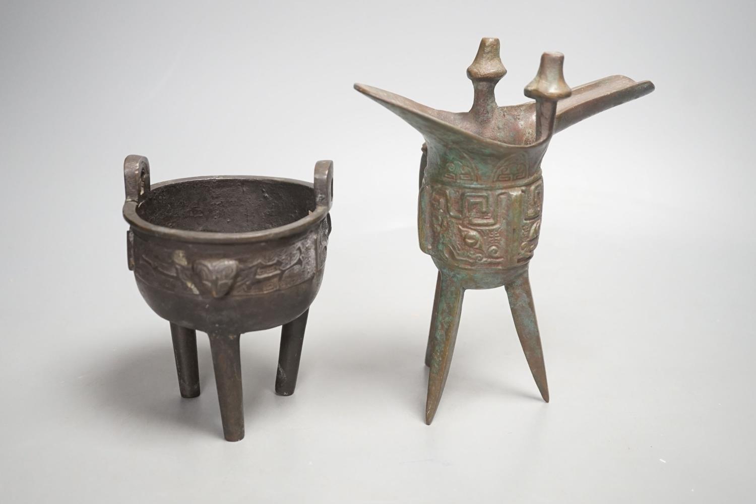A Chinese bronze wine vessel and bronze tripod censer,wine vessel 19cms high