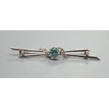 A 14ct white gold, blue zircon and diamond chip set bar brooch, 53mm, gross weight 3.3 grams.