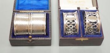 A cased pair of George V engine turned silver napkin rings, by Charles Horner, Chester, 1923 and