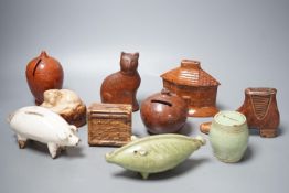 A collection of ten, 19th century Dutch and British pottery money boxes - tallest cat money box 12