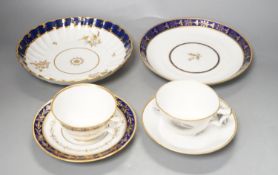 A Flight Barr and Barr teacup and saucer printed with shells, similar teacup and saucer with blue