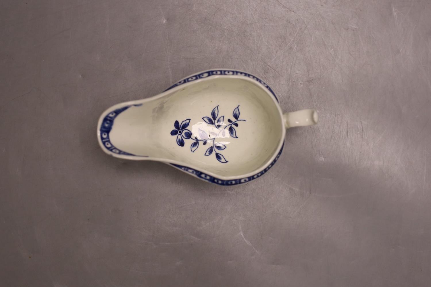 A Worcester sauceboat painted with the Strap Fluted Floral pattern c. 1768-72,16.5 cms wide. - Image 3 of 4
