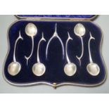 A novelty set of six Edwardian novelty silver wish bone handled teaspoons and matching sugar