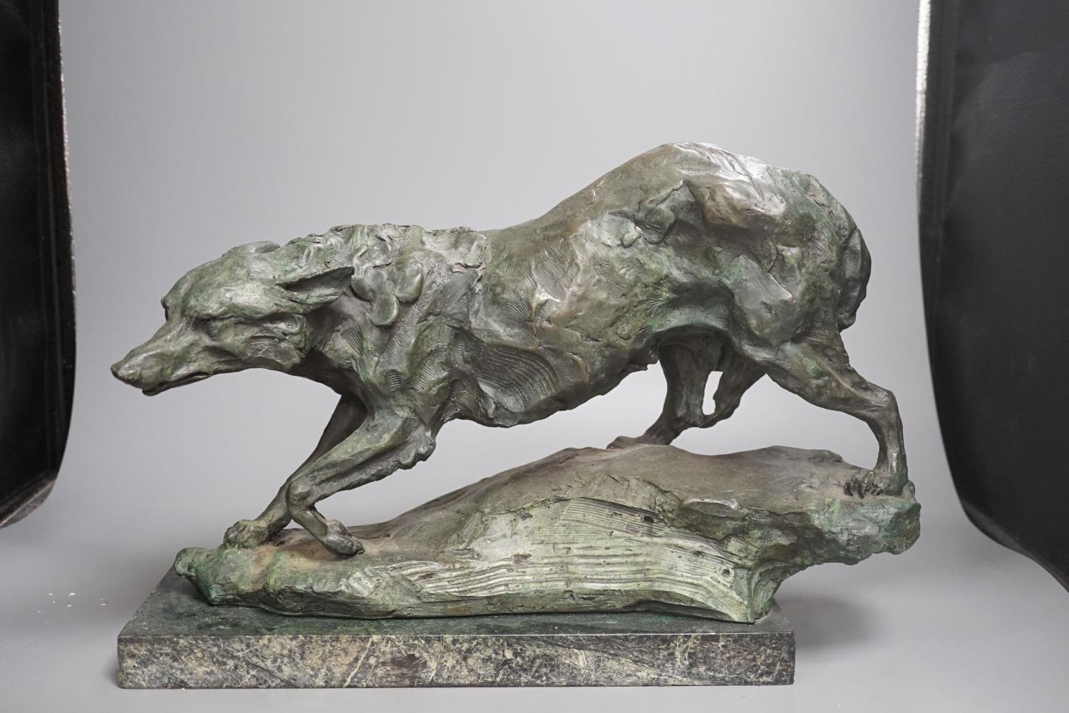 B.C. King, a green patinated bronze of a wolf,43 cms wide.