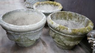 A set of three circular reconstituted stone garden planters with swagged bodies, diameter 48cm,