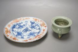A Chinese Imari plate, Kangxi period and a Chinese celadon ground tripod censer, plate diameter